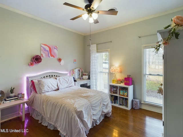 bedroom featuring ceiling fan, dark hardwood / wood-style floors, crown molding, and multiple windows