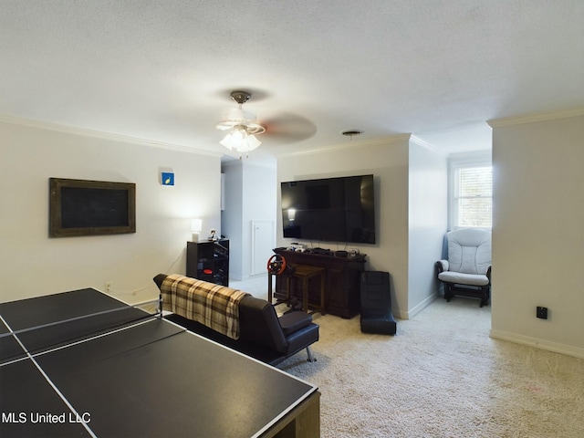 game room with ceiling fan, crown molding, and light colored carpet