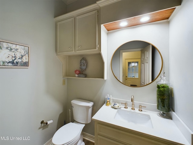 bathroom with toilet and vanity