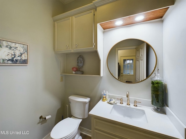 bathroom featuring toilet and vanity