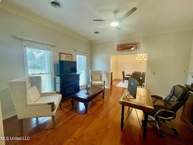 interior space with ceiling fan, wood-type flooring, and crown molding