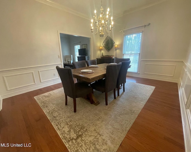 dining space featuring a notable chandelier, dark hardwood / wood-style flooring, and crown molding