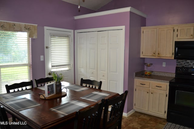 dining space with vaulted ceiling