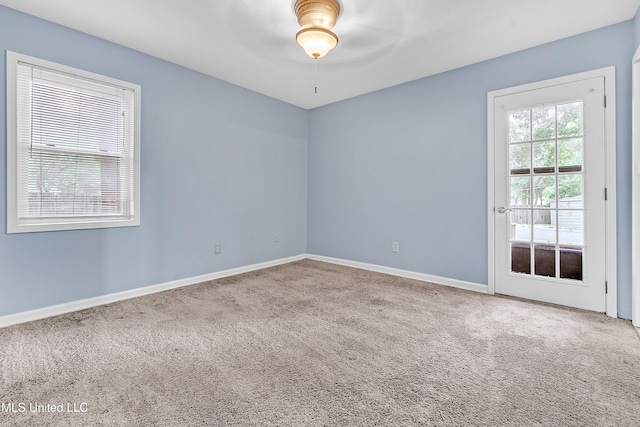 6830 Embassy Cir, Horn Lake, MS 38637 - empty room featuring carpet floors, ceiling fan, and baseboards