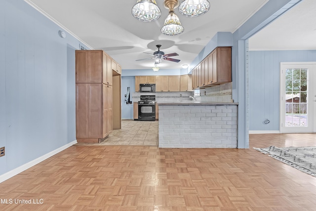 6830 Embassy Cir, Horn Lake, MS 38637 - kitchen featuring black appliances, a chandelier, ceiling fan, baseboards, and crown molding
