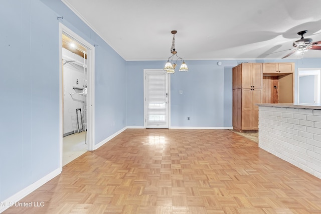 6830 Embassy Cir, Horn Lake, MS 38637 - unfurnished living room with ceiling fan, baseboards, and crown molding