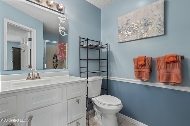 172 Briarfield Ave, Biloxi, MS 39531 - full bathroom with a textured ceiling, a shower stall, vanity, and tile patterned floors
