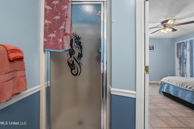 172 Briarfield Ave, Biloxi, MS 39531 - bedroom featuring light tile patterned floors, a textured ceiling, and a ceiling fan