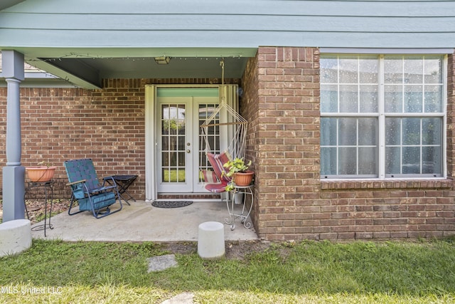 172 Briarfield Ave, Biloxi, MS 39531 - entrance to property featuring french doors, a patio, and brick siding