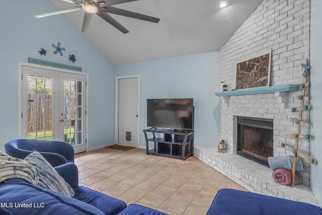 172 Briarfield Ave, Biloxi, MS 39531 - living area with tile patterned flooring, french doors, ceiling fan, a fireplace, and high vaulted ceiling