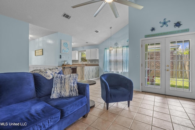 172 Briarfield Ave, Biloxi, MS 39531 - living area with ceiling fan, light tile patterned flooring, vaulted ceiling, healthy amount of natural light, and french doors