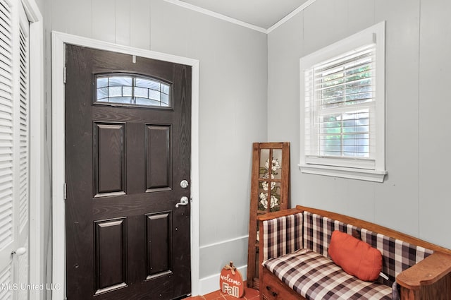 foyer featuring ornamental molding