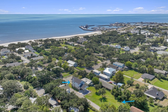 drone / aerial view with a water view and a view of the beach