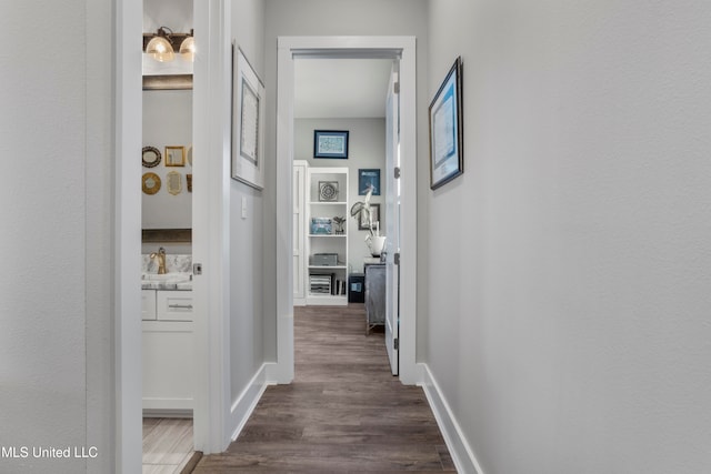 corridor with dark wood-type flooring