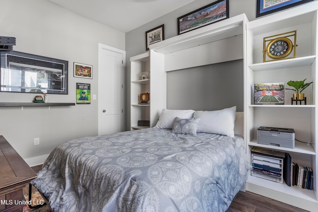 bedroom featuring dark hardwood / wood-style floors