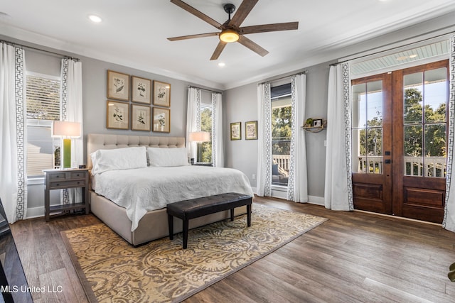 bedroom featuring ceiling fan, dark hardwood / wood-style flooring, access to outside, and french doors