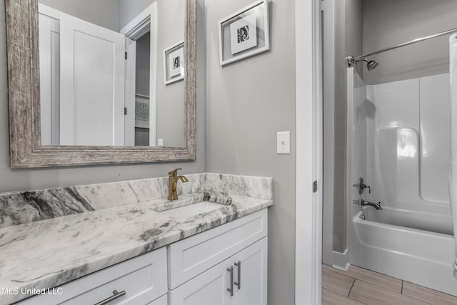 bathroom with shower / tub combination and vanity