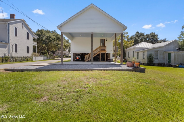 back of house with a yard