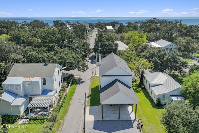 birds eye view of property with a water view