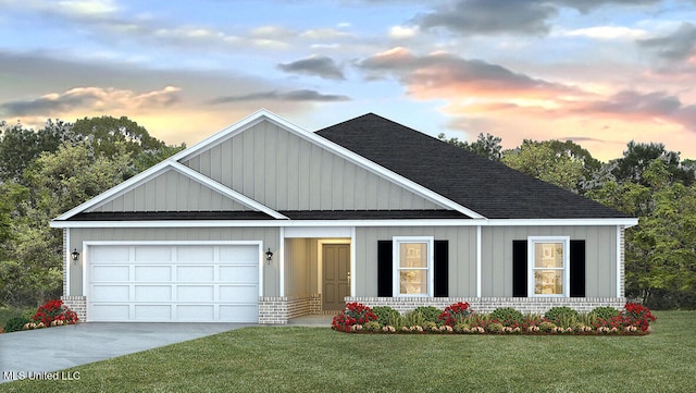 9614 Reserve Blvd, Biloxi, MS 39532 - view of front facade with a shingled roof, a garage, a front lawn, concrete driveway, and brick siding