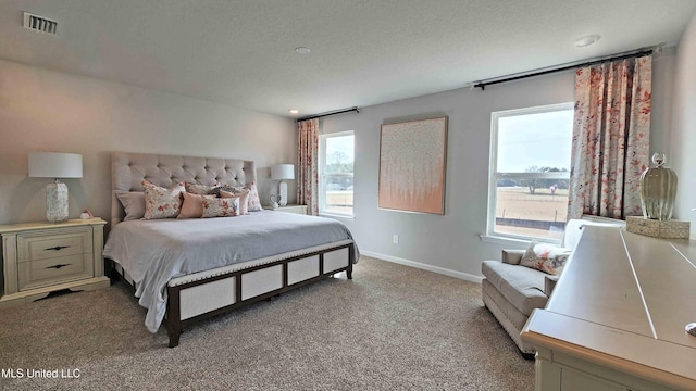 9614 Reserve Blvd, Biloxi, MS 39532 - bedroom featuring light colored carpet and a textured ceiling