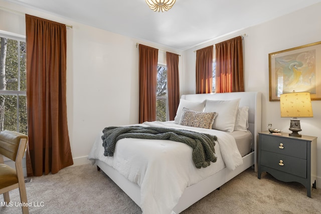 bedroom featuring light colored carpet