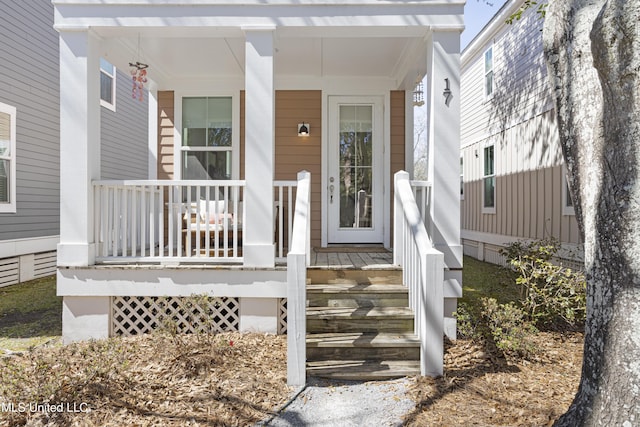 doorway to property featuring a porch