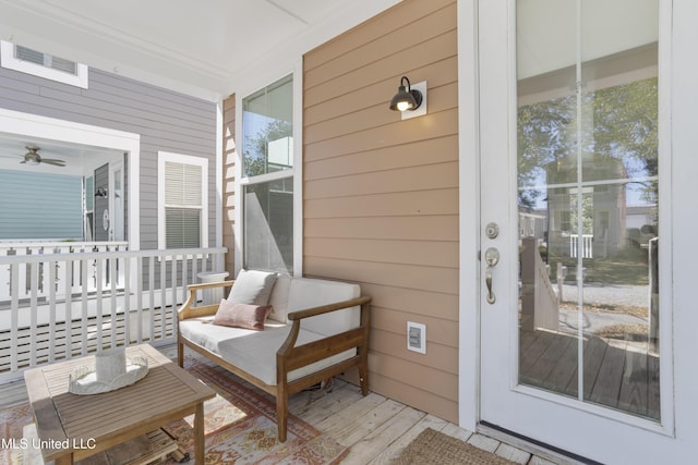 view of exterior entry with a porch and visible vents