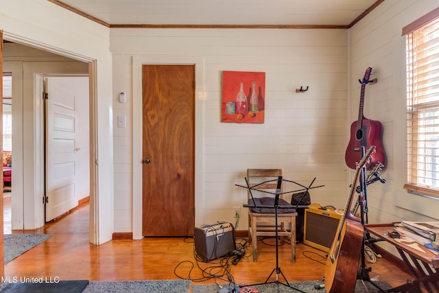 miscellaneous room with hardwood / wood-style flooring and ornamental molding