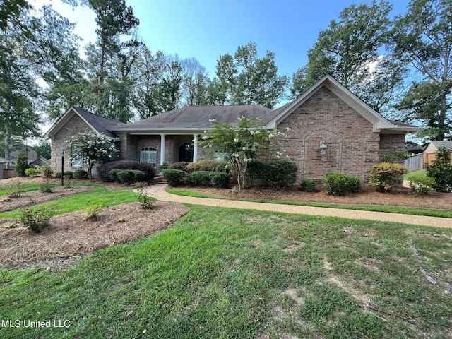 ranch-style home with a front yard