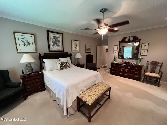 carpeted bedroom with crown molding and ceiling fan