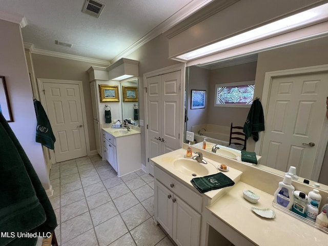 bathroom with vanity, crown molding, a washtub, and tile patterned flooring