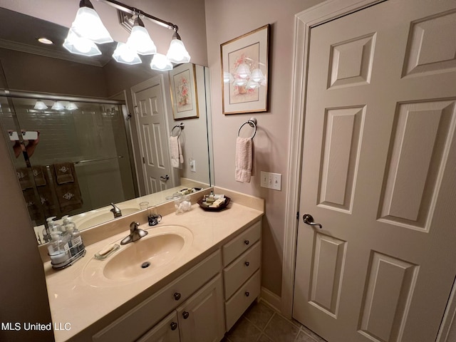 bathroom featuring vanity, an enclosed shower, and tile patterned flooring