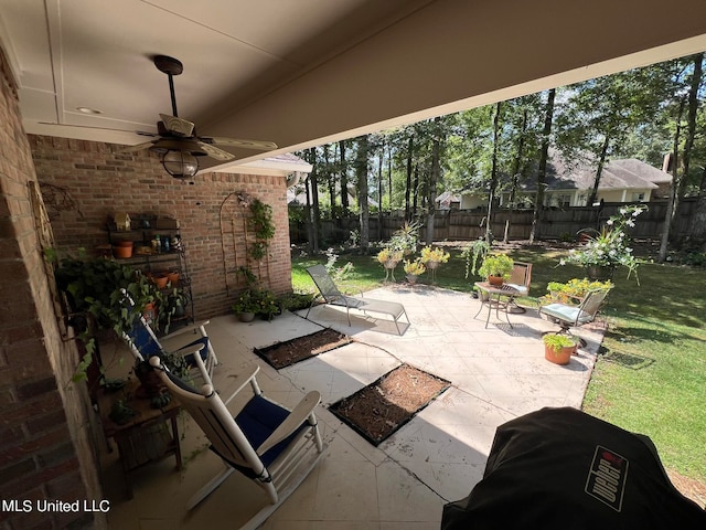 view of patio featuring ceiling fan