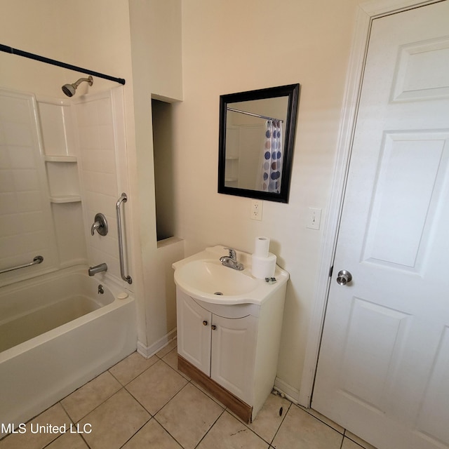 full bathroom with tile patterned floors, shower / bath combo with shower curtain, baseboards, and vanity