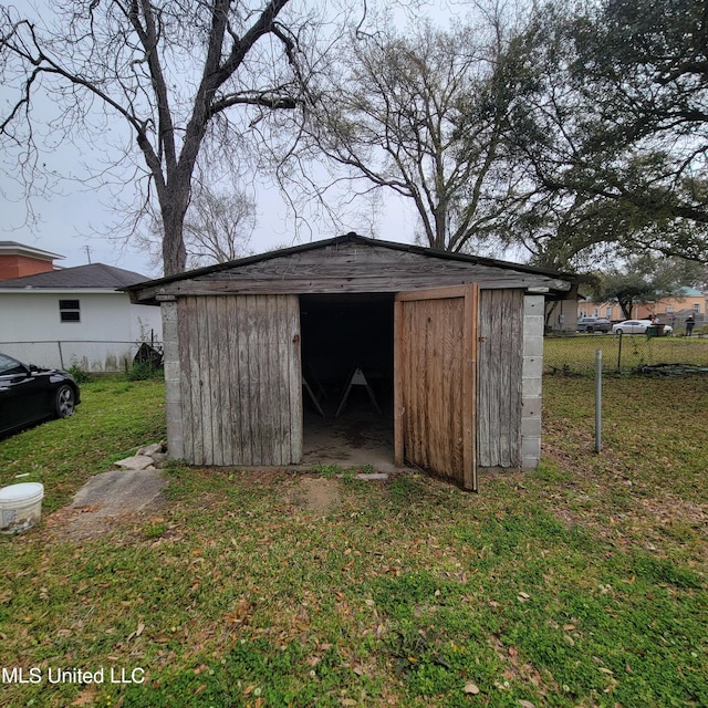view of outdoor structure with an outdoor structure and fence