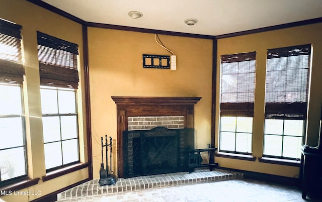 living room featuring crown molding and a fireplace