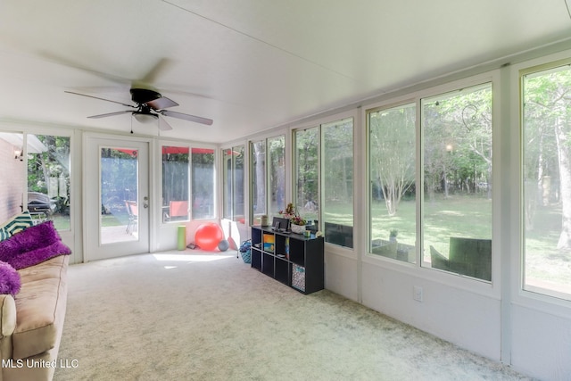sunroom / solarium with plenty of natural light and a ceiling fan