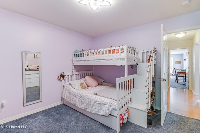 carpeted bedroom with baseboards