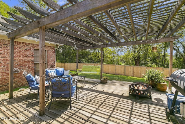 deck with an outdoor living space with a fire pit and a pergola