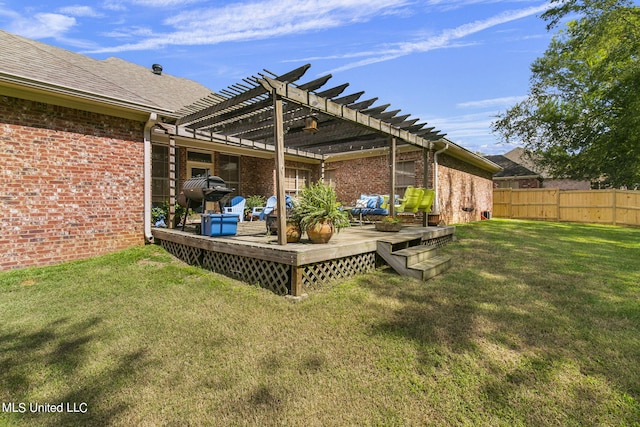 view of yard with a wooden deck and a pergola