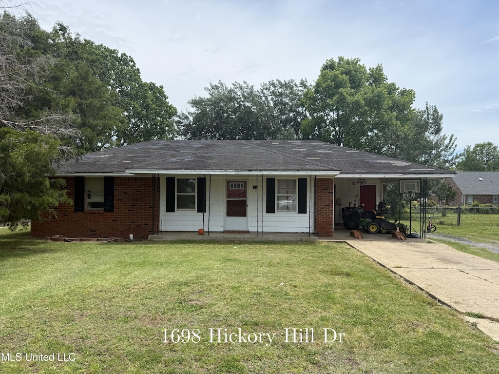 ranch-style house featuring a carport, a front lawn, driveway, and a porch