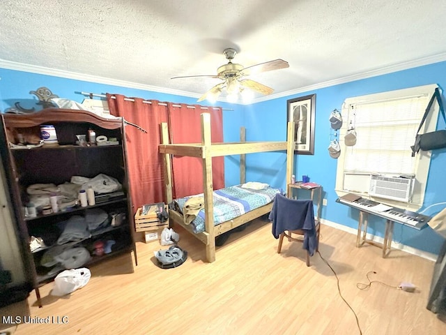 3755 Jayne Ave, Jackson, MS 39209 - bedroom with a textured ceiling, crown molding, cooling unit, wood finished floors, and a ceiling fan