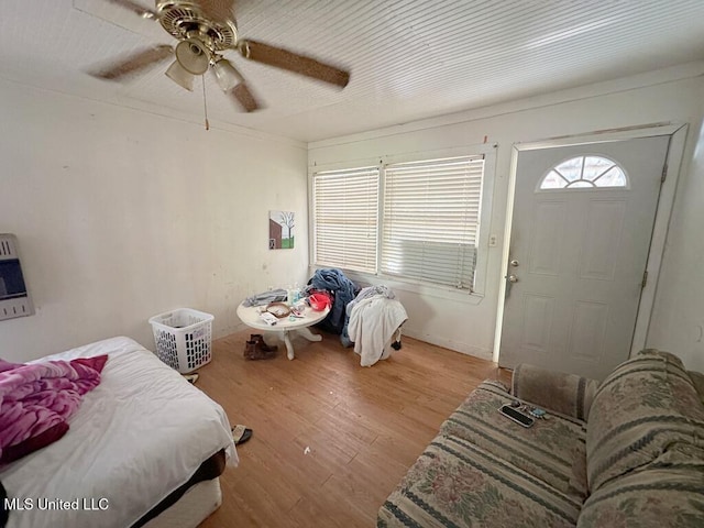 3755 Jayne Ave, Jackson, MS 39209 - bedroom featuring wood finished floors, ceiling fan, and heating unit