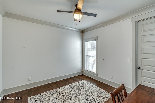 unfurnished room with dark wood-type flooring, ceiling fan, and ornamental molding