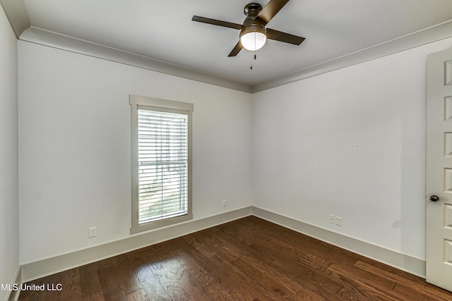 unfurnished room featuring ceiling fan, dark wood-type flooring, and ornamental molding