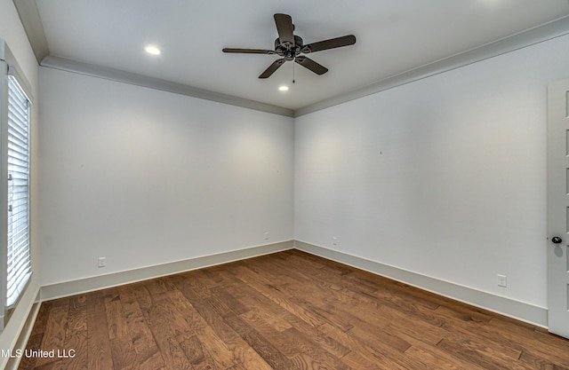 empty room featuring ceiling fan, plenty of natural light, and wood-type flooring