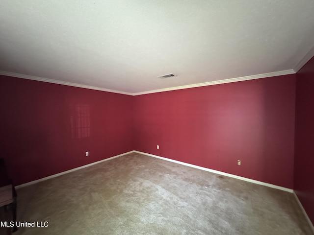 unfurnished room with ornamental molding, baseboards, and carpet