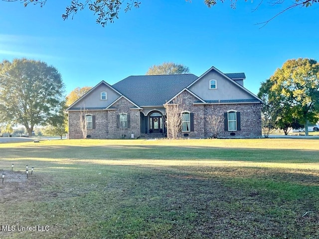 6 Lunker Ln, Poplarville, MS 39470 - view of front facade featuring a front yard and brick siding