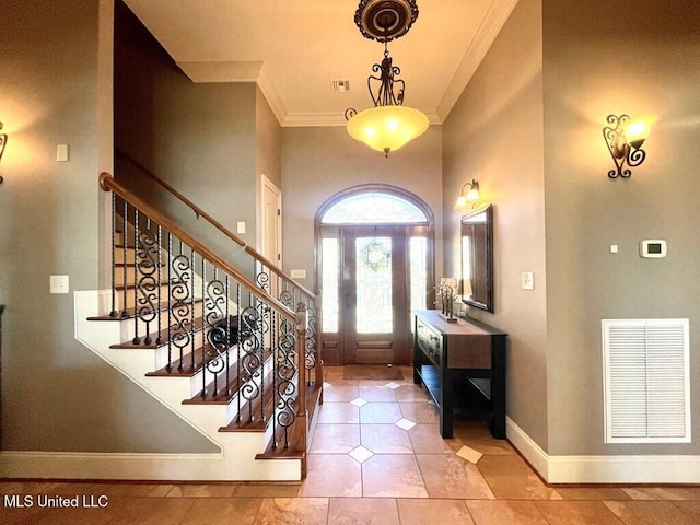 6 Lunker Ln, Poplarville, MS 39470 - tiled foyer featuring crown molding, stairway, a high ceiling, and baseboards